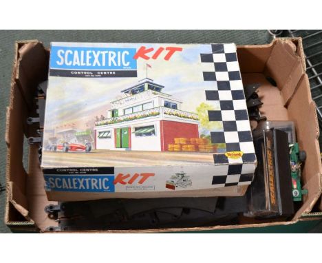 A vintage Tri-ang Scalextric control centre with a quantity of rubber Scalextric track