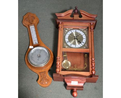 An oak backed barometer thermometer and modern Viennese wall clock