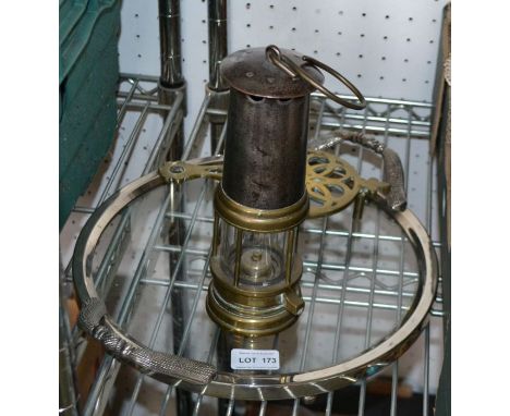 a vintage miners lamp, a trivet and a tray