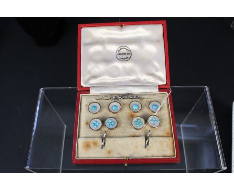 A 9ct gold cufflink and button set, each one set with a mother of pearl and small turquoise stones (one turquoise missing) in