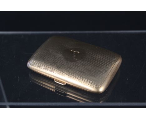 A 9ct gold cigarette case with engine turned decoration, engraved name to centre (heavily dented), approx 44.5g