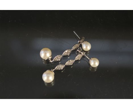 A pair of 9ct white gold pearl and diamond drop earrings (can be adjusted to single pearl studs)