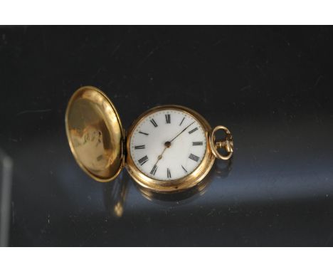 A continental 18ct gold cased hunter fob watch with enamel decoration to front (two of three rough cut diamonds), (substantia