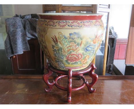 HANDPAINTED AND GILDED ORIENTAL STYLE CERAMIC FISH BOWL ON WOODEN STAND 