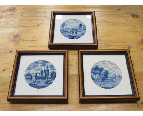 SET OF THREE FRAMED BLUE AND WHITE CERAMIC TILES 