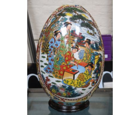 LARGE ORIENTAL CERAMIC EGG ON STAND, APPROXIMATELY 34cm HIGH 