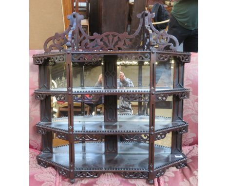 CARVED MAHOGANY PIERCEWORK AND MIRRORBACK WALL MOUNTING SHELF