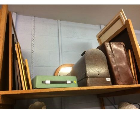 Shelf of assorted including sewing machine