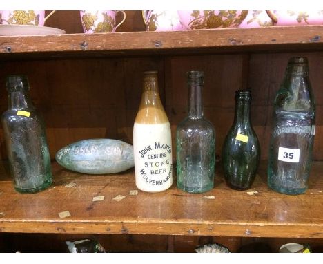 Five glass bottles including; Palatine Bottling Co, Read and Sons, W Mitchell, R Ellis and Sons, blank bottle and a stoneware
