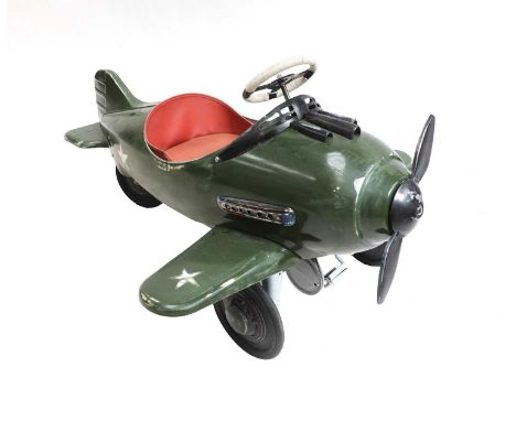 A pedal plane, in the manner of Steelcraft, with a green-enamelled cigar-shaped body, with two wheels to the front,120cm long