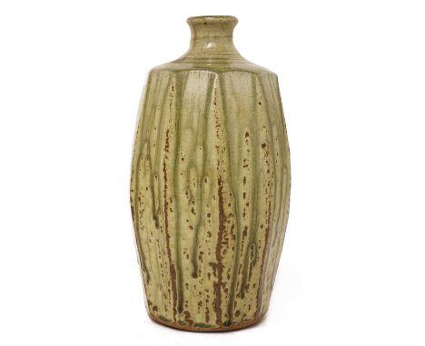 *Jim Malone (b.1946),a stoneware bottle vase, with a facet body, a short waisted neck and a trailing green glaze, impressed a