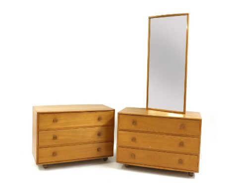 A pair of Ercol elm chests of drawers,1960s, each with three drawers with turned handles, on plastic castors, 91.5cm wide48cm