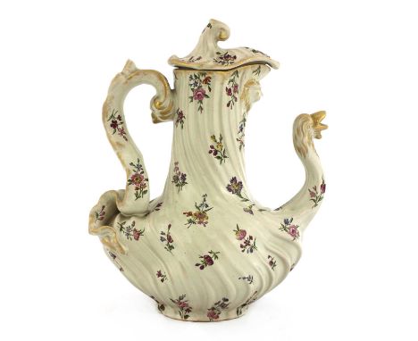 An Émile Gallé faience teapot, c.1890, of twisted form, with partially-gilt floral decoration, the spout in the form of a goo