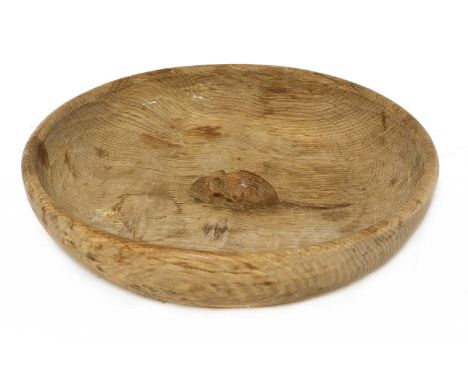 A Robert 'Mouseman' Thompson oak fruit bowl,with an adzed bowl and body, the centre carved with a signature mouse,29.5cm diam