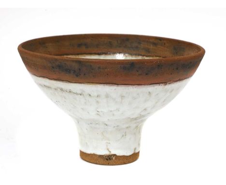 *Robin Welch (1936-2019),a footed stoneware bowl, partially glazed in a shino glaze, impressed with potter's mark under the f