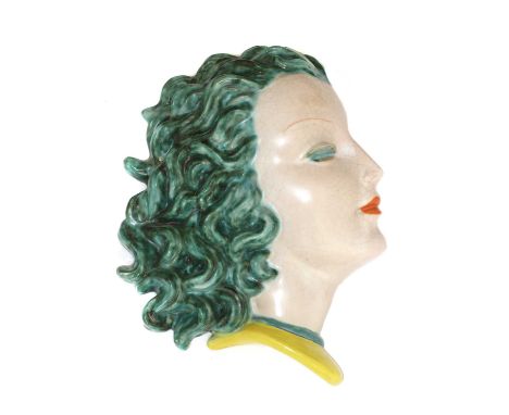 A Goldscheider pottery wall mask,no. 7496/8, modelled as a lady in profile, with turquoise hair and eyelids, and with orange 