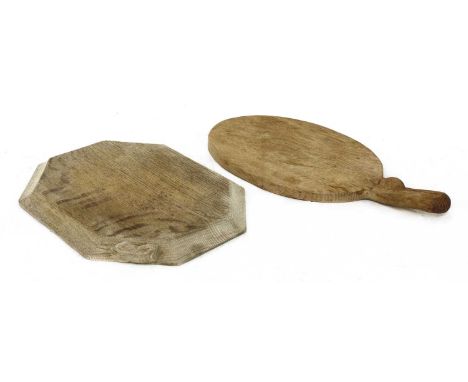 Two Robert 'Mouseman' Thompson breadboards,one of octagonal moulded form, the other, oval with a handle, both carved with the
