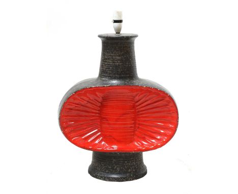 A West German glazed pottery lamp base,with a mottled ground, centred with a concave fan-shaped design,41cm wide18cm deep58cm
