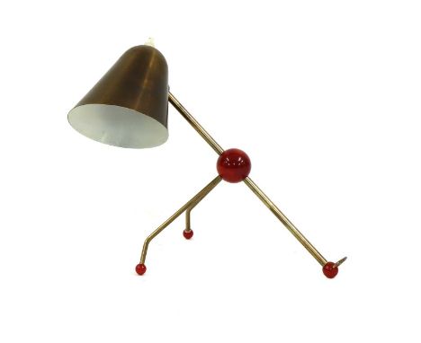 A desk or wall lamp,1950s, designed by Otto Kolb (1912-1996), with a lacquered brass shade, mounts and bakelite 'marbled' sph