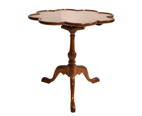 A reproduction mahogany tilt top tripod table with birdcage action, height 68cm, diameter 67cm.Additional InformationNumerous