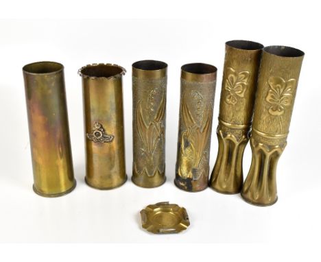 A collection of trench art and shell cases, one with embossed Royal Artillery emblem, height of largest 34cm, and a trench ar