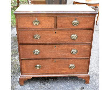 An early 19th century oak chest of two short and three long drawers on bracket feet, width 104cm, depth 54cm, height 108.5cm.