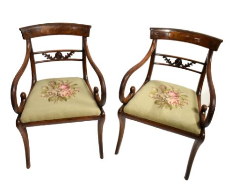 A pair of Regency mahogany bar back elbow chairs with drop-in seats and supports (2).Additional InformationOne has a patch to