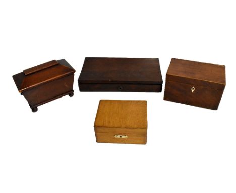 A Victorian sarcophagus shaped oak tea caddy, the hinged cover enclosing a single lid with two compartments, a Georgian mahog