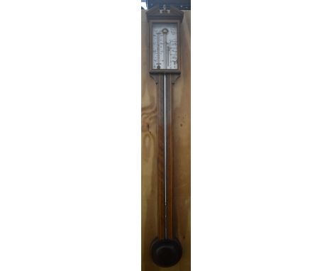 COMITTI; a reproduction inlaid oak cased stick barometer, with brass urn finial and silvered dial, height 96cm.&nbsp;