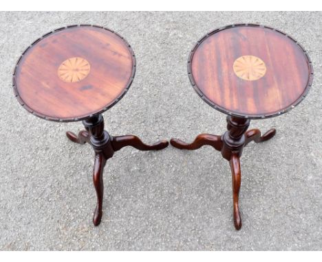 A pair of Edwardian inlaid mahogany tripod wine tables, height 44cm, diameter 25cm.Additional InformationEach with general we