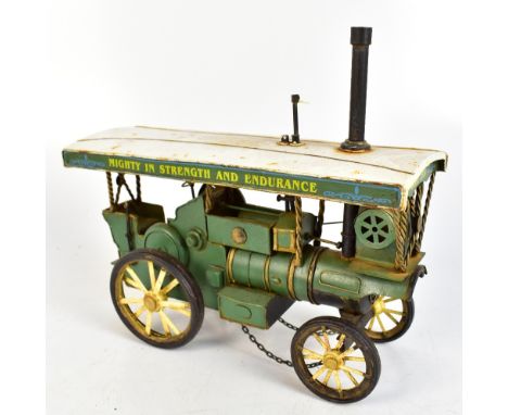 A model steam engine painted in white and green with motto 'Mighty in Strength and Endurance 1914', length 31cm.Additional In