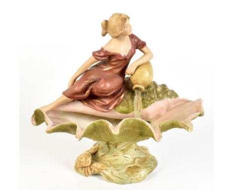 ROYAL DUX; an Art Nouveau pedestal figural bowl in the form of a maiden beside a water urn with open conch shell, embossed pi