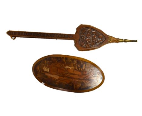 ATTRIBUTED TO THE MACCLESFIELD SCHOOL OF CARVING; a pair of carved oak bellows with brass nozzle inscribed 'Amor Vincit Omnia