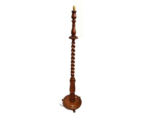A South African yellow wood rope twist standard lamp with circular base, height 157cm.Additional InformationSome general wear