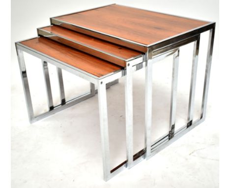 RICHARD YOUNG FOR MERROW ASSOCIATES; a nest of chrome framed rosewood coffee tables, dimensions of largest example height 49c