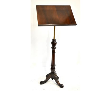 A Victorian mahogany lectern on brass column, the base with turned column and tripod supports, height 122cm, width 47cm, dept