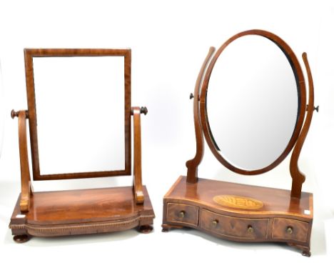 Two late Victorian/Edwardian mahogany toilet mirrors, the larger of serpentine outline with marquetry and further inlaid deta