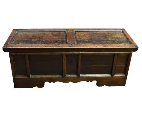 An 18th century oak coffer on shaped bracket feet, length 148cm, depth 55cm, height 55cm.