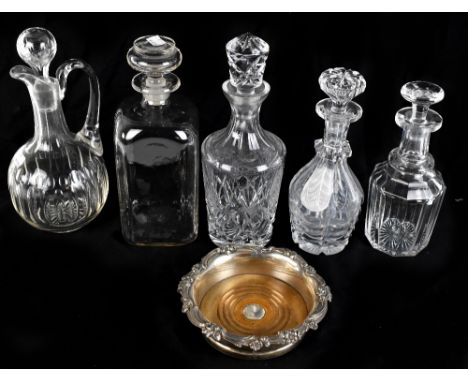 Five 19th century and later glass decanters and claret jug, also a silver mounted bottle stand (6).Additional InformationThe 