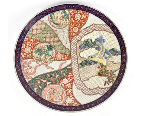 A Japanese Meiji period Imari wall charger, painted with stylised exotic birds and Shishi dog, diameter 55.5cm.Additional Inf