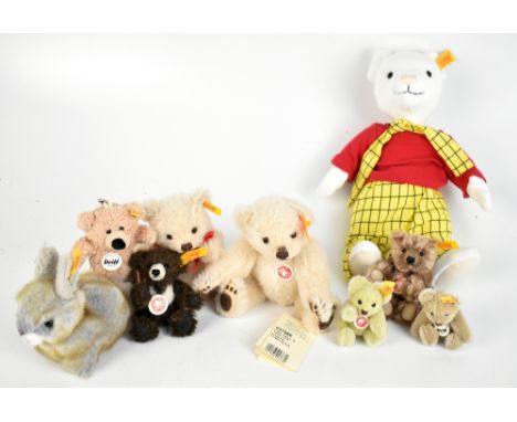 STEIFF; a Rupert Bear in classic outfit, seven small and miniature sized bears and a rabbit, all with button in ear and furth