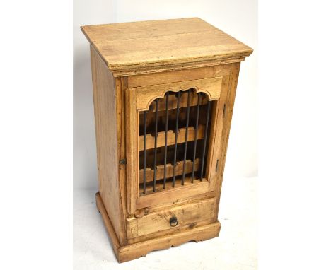 A reproduction wine cabinet, the single door enclosing fixed shelf above base drawer, height 98cm.Additional InformationMinor