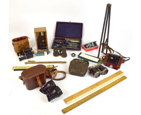 A group of collectors' items including a cased set of drafting instruments, two with ivory handles stamped 'Thornton', rules,