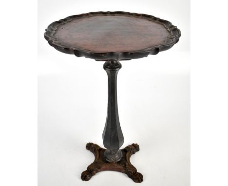 An iron framed tilt top tripod table with later ebonised top,&nbsp;height 49cm.Additional InformationThe table is a marriage,