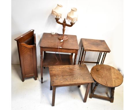 A 19th century mahogany two tier occasional table, a nest of two tables, an oak circular occasional table, a rectangular exam