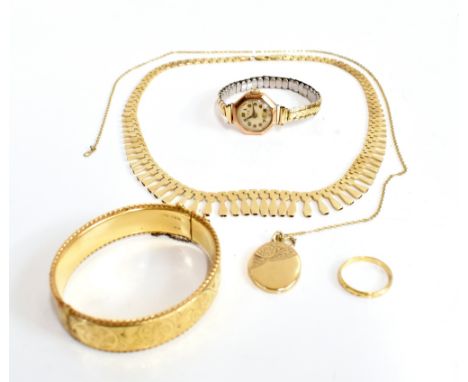 A 9ct yellow gold lady's necklace with drop detail, a 9ct locket on yellow metal chain, an 18ct gold wedding band with chased