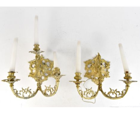 A pair of brass three light wall sconces with pierced Gothic inspired detail, width 30cm, (one af).Additional InformationOne 