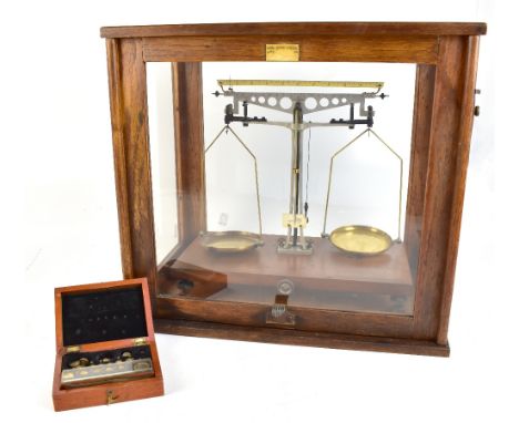 A pair of chemical balance scales stamped 'SA Precision', in glazed case bearing label inscribed 'A. Gallenkamp &amp; Co Ltd 