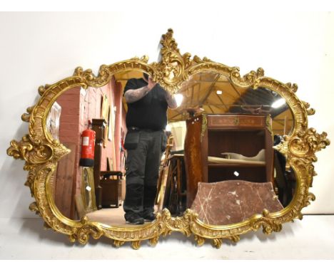 A large decorative Rococo-style gilt mirror, 120 x 176cm.Additional InformationLight general wear.