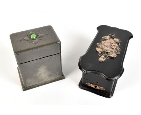 An ebonised trinket box of shaped rectangular form with applied silver plated panel depicting an Art Nouveau bust beside swan